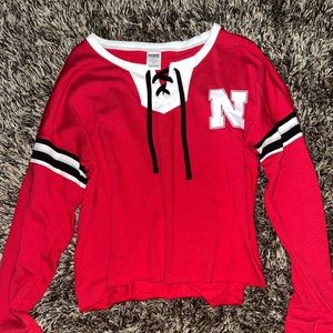Size medium. Pink Victoria Secret. Long sleeve red Nebraska shirt.